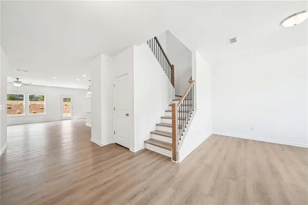 a view of entryway with wooden floor