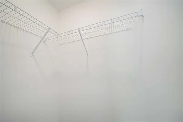 a view of a room with racks on the wall