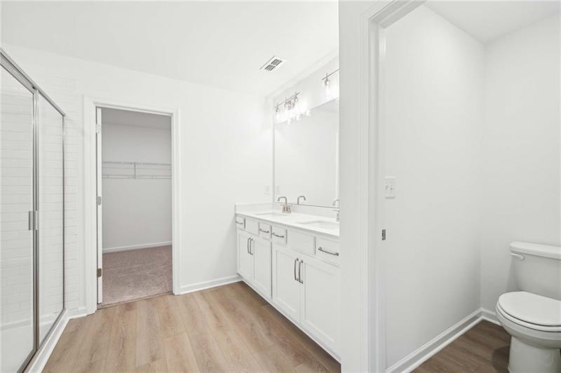 320 Silverleaf Trail Bethlehem, GA 30620 - Photo 28 of 36 a bathroom with a sink a toilet and shower