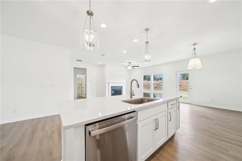 320 Silverleaf Trail Bethlehem, GA 30620 - Photo 10 of 36 an open kitchen with a sink and dish washer