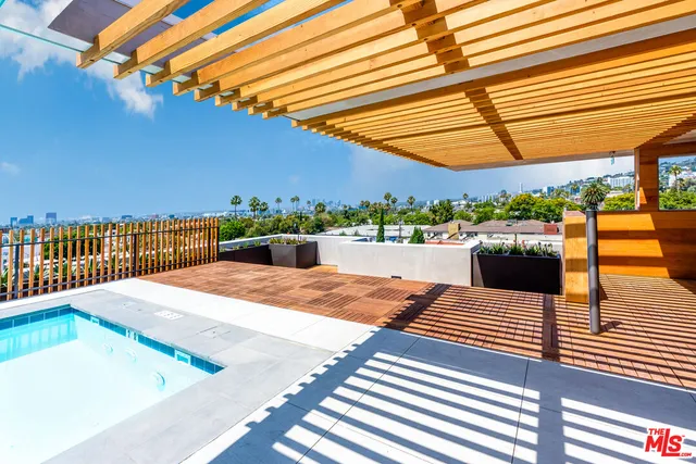 a view of outdoor space with wooden floor and fence