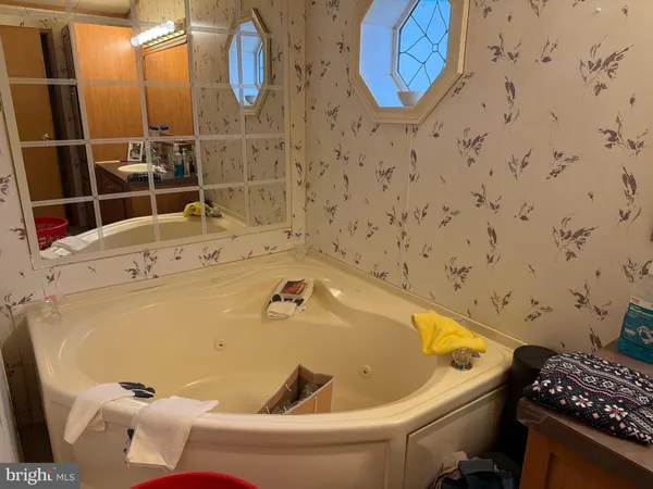 a bathroom with a tub and sink