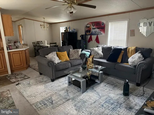 a living room with furniture and a window