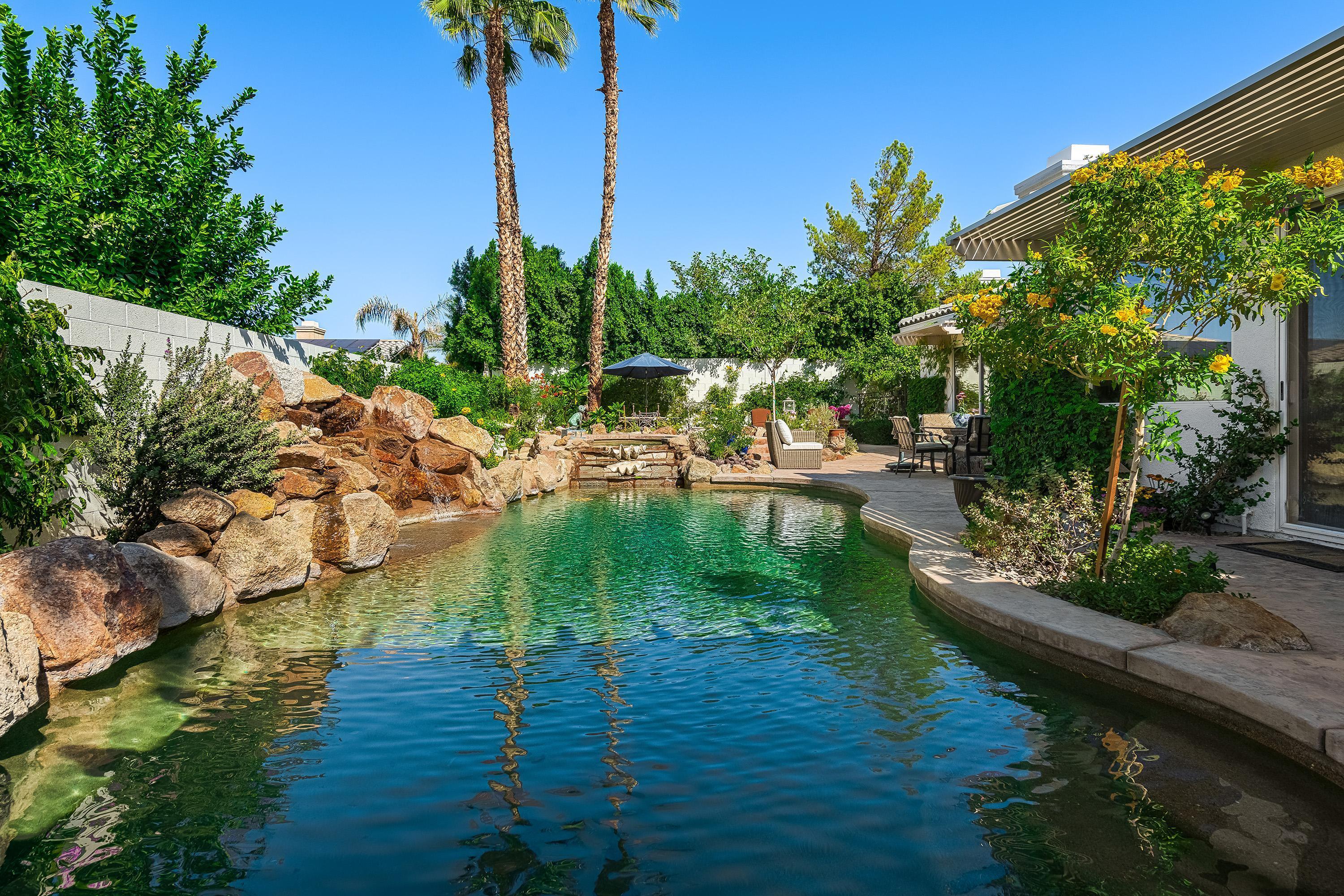 3 Trafalgar Rancho Mirage, CA 92270 - Photo 20 of 42 a view of a lake with houses