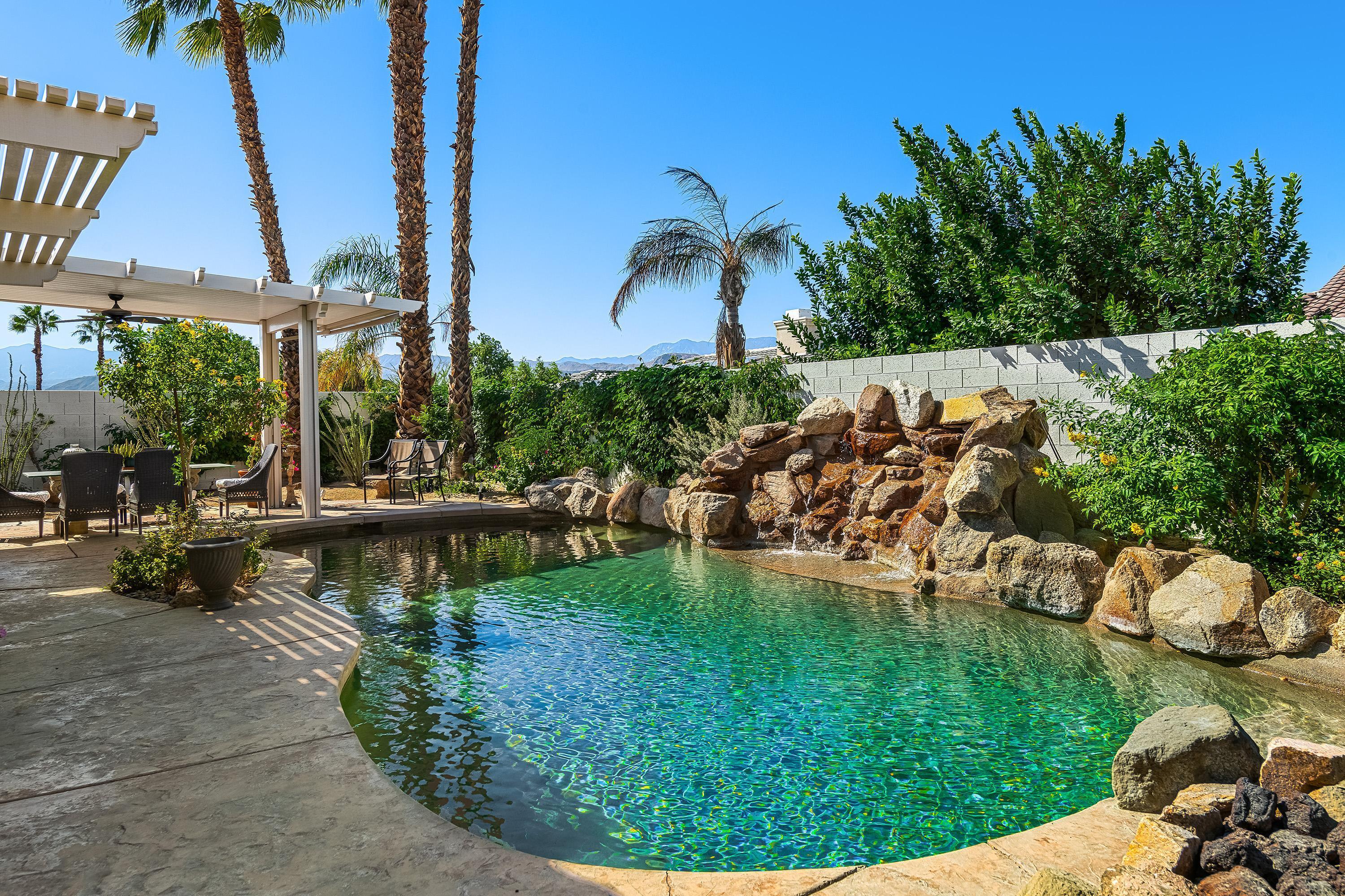 3 Trafalgar Rancho Mirage, CA 92270 - Photo 22 of 42 a view of a lake with a park