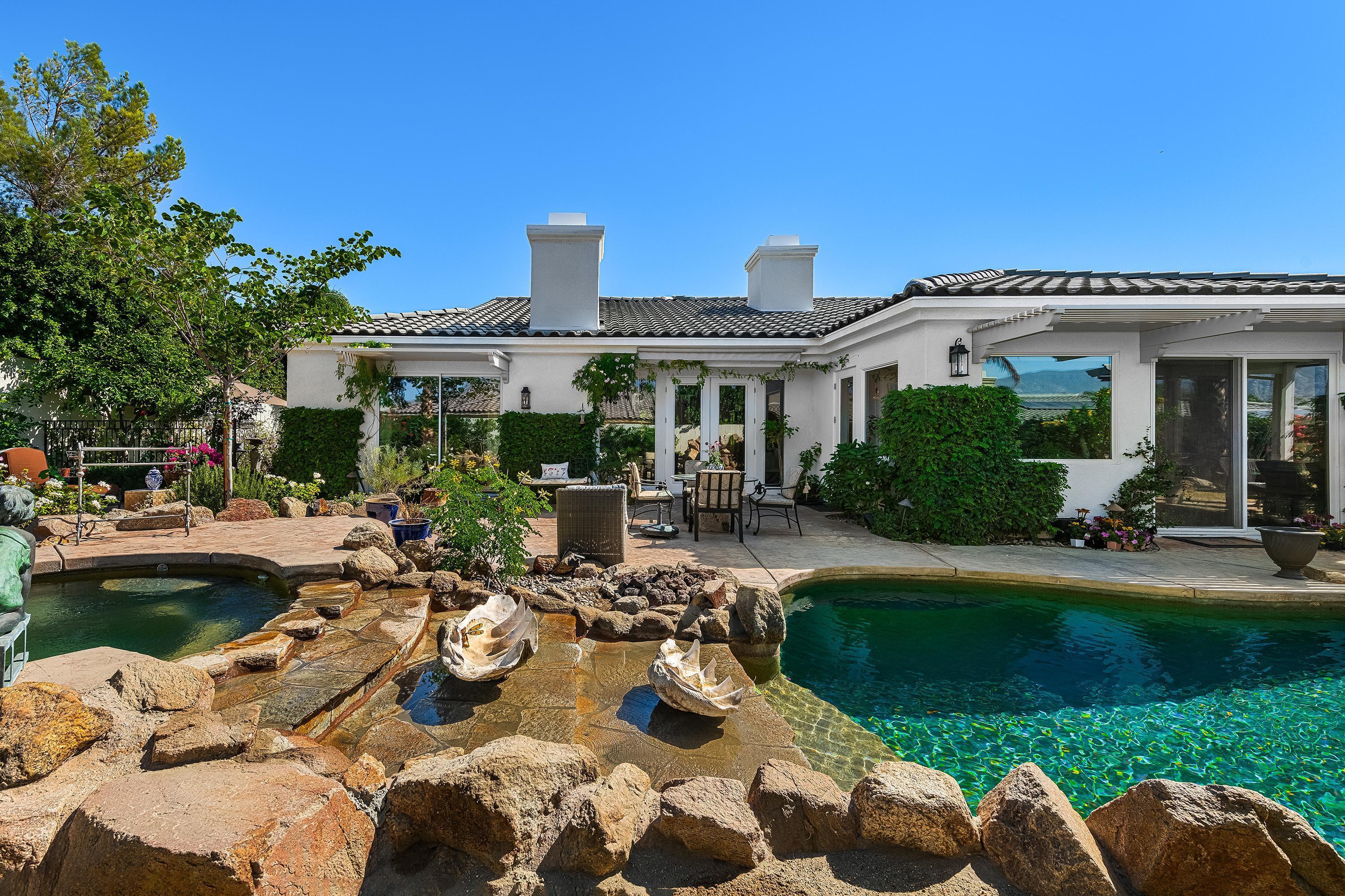 3 Trafalgar Rancho Mirage, CA 92270 - Photo 23 of 42 a view of a house with backyard patio and swimming pool