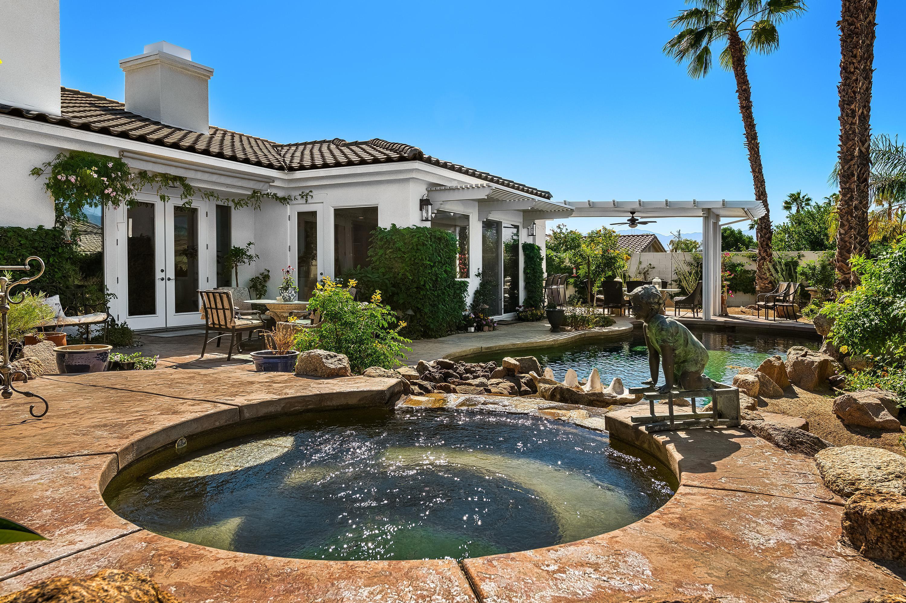 3 Trafalgar Rancho Mirage, CA 92270 - Photo 24 of 42 a view of a house with pool and sitting area