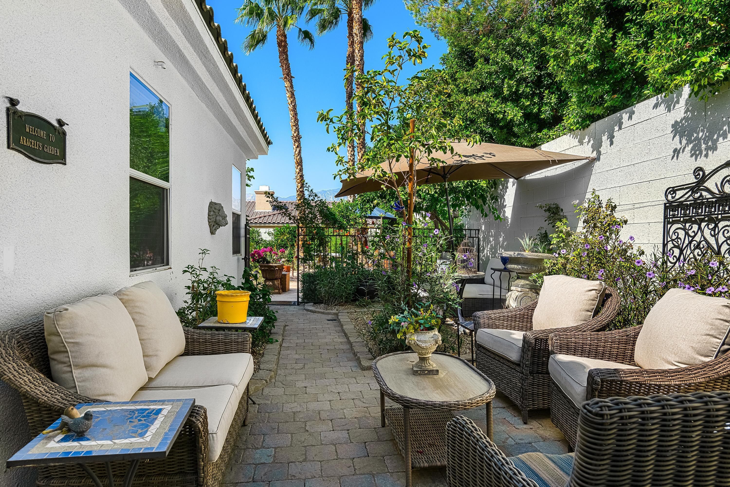3 Trafalgar Rancho Mirage, CA 92270 - Photo 27 of 42 a outdoor living space with furniture and a potted plant