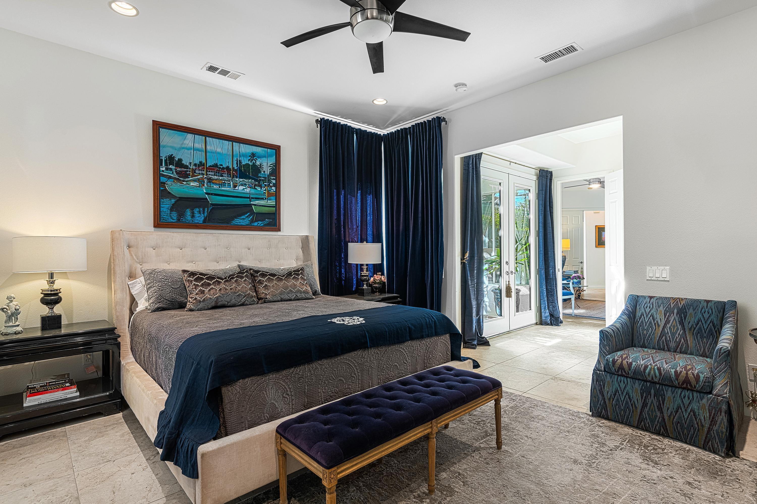 3 Trafalgar Rancho Mirage, CA 92270 - Photo 32 of 42 a bedroom with bed and a couch