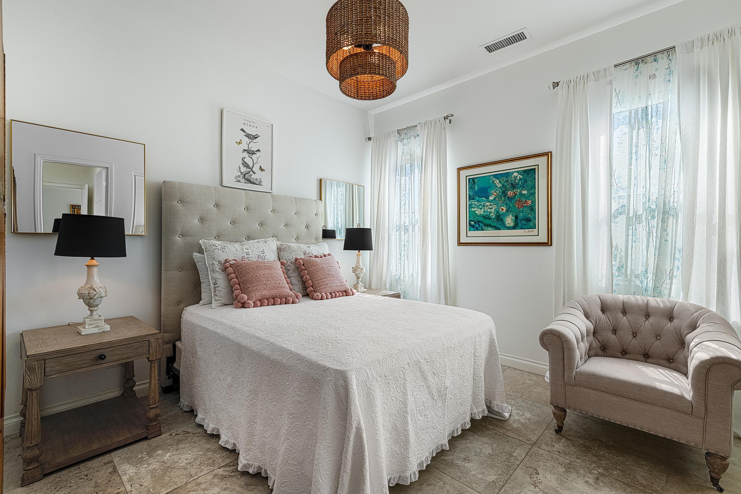 3 Trafalgar Rancho Mirage, CA 92270 - Photo 34 of 42 a bedroom with bed and a couch