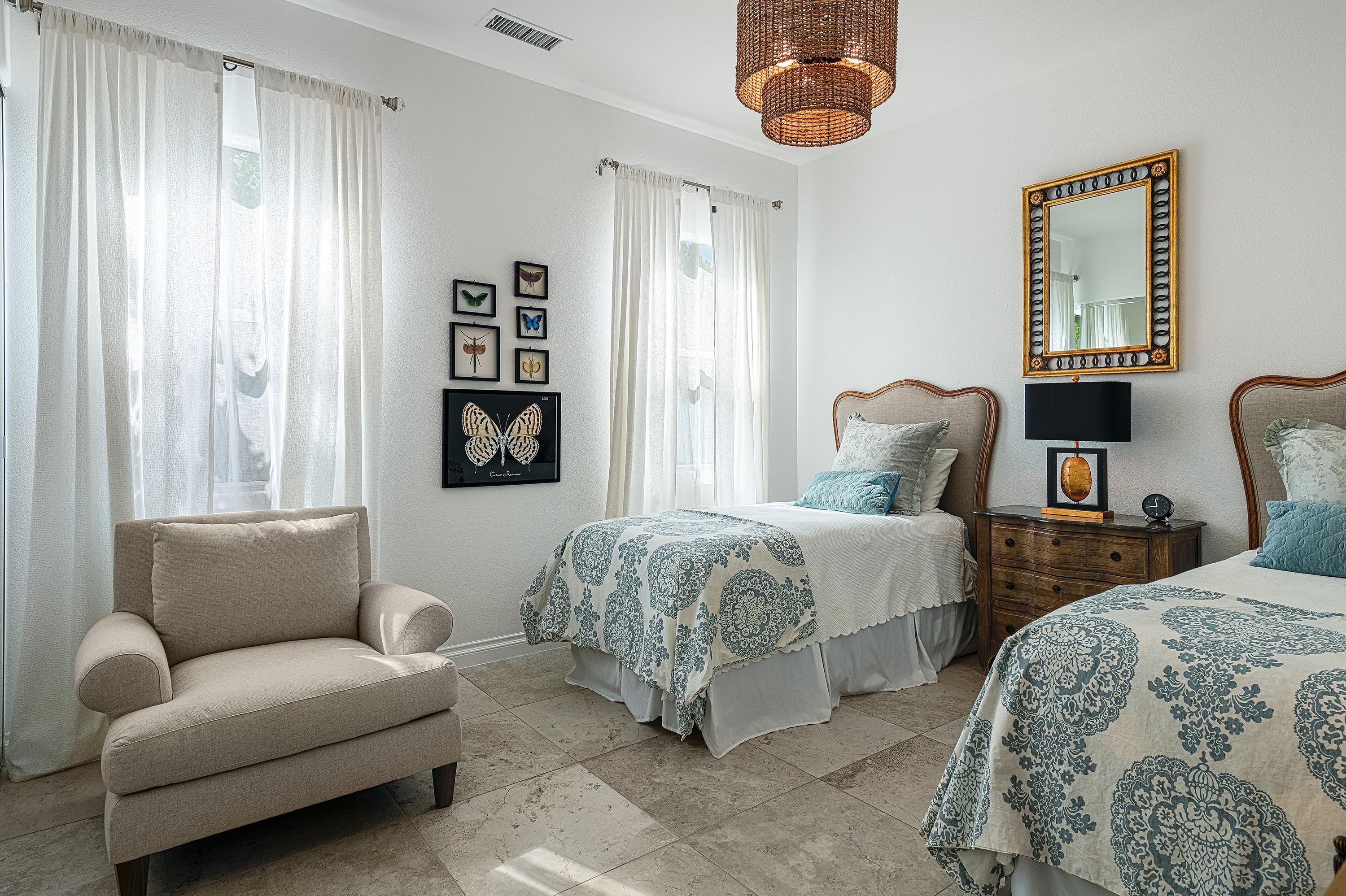 3 Trafalgar Rancho Mirage, CA 92270 - Photo 37 of 42 a bedroom with bed and a couch