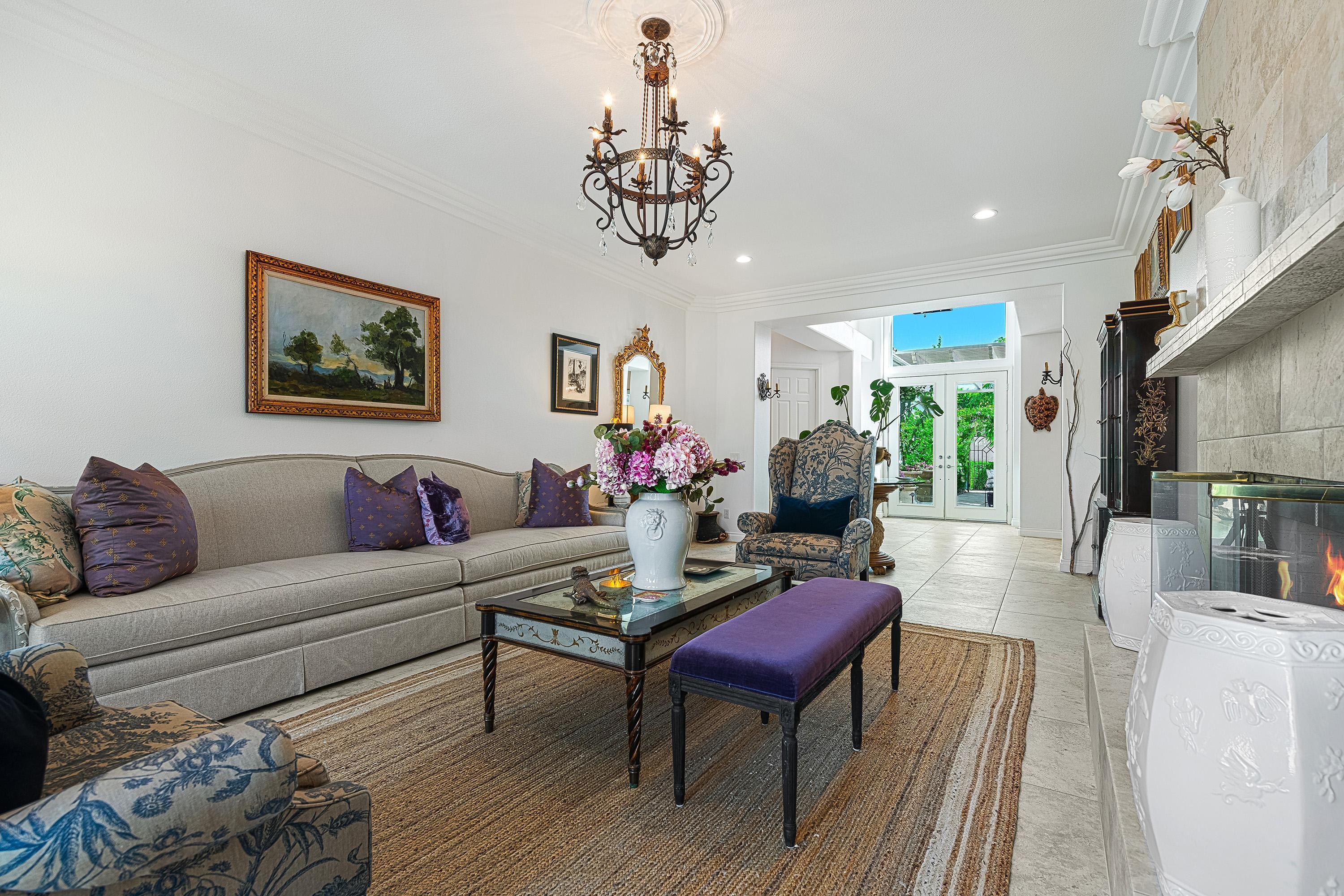 3 Trafalgar Rancho Mirage, CA 92270 - Photo 5 of 42 a living room with furniture a chandelier and a rug