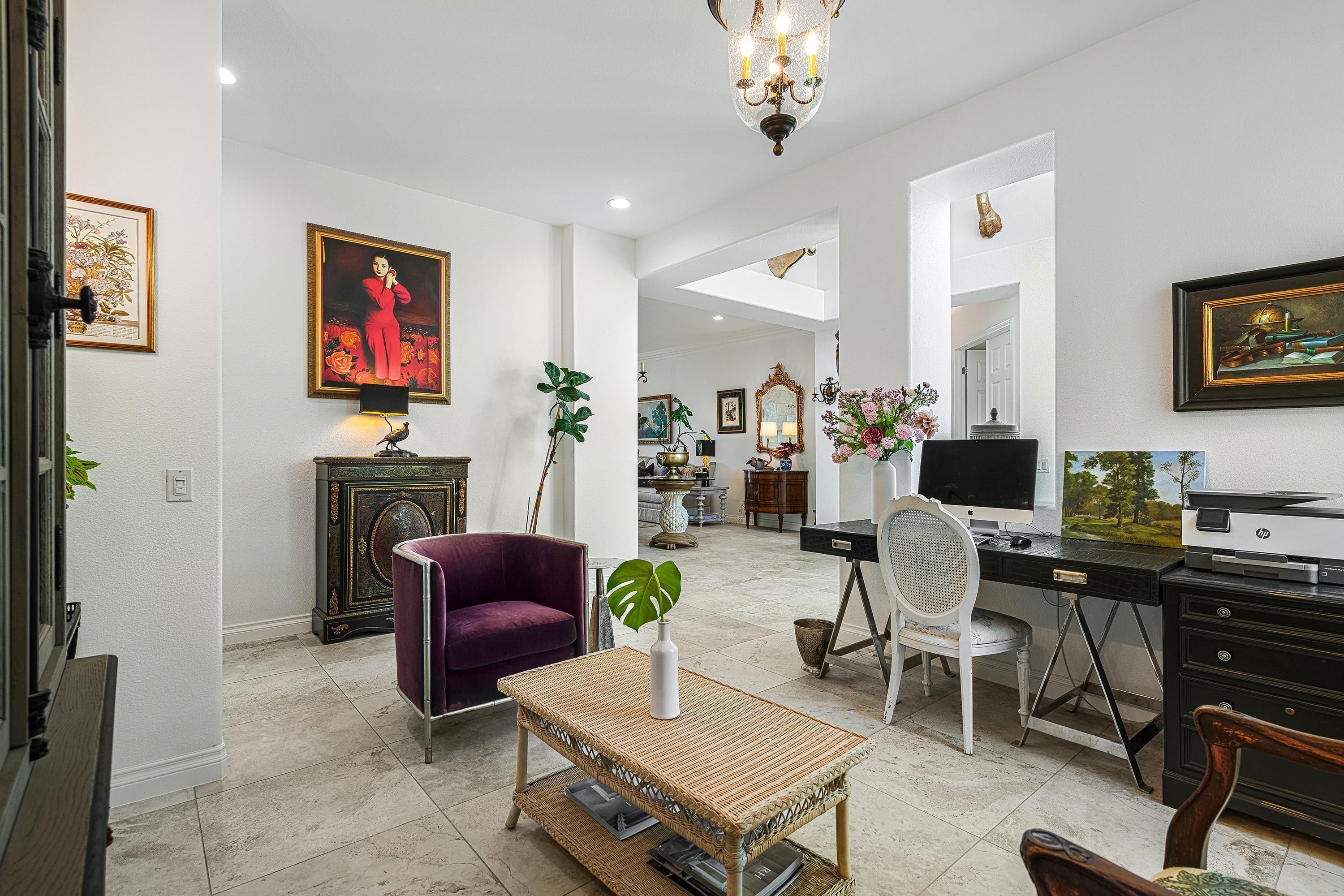 3 Trafalgar Rancho Mirage, CA 92270 - Photo 7 of 42 a living room with fireplace furniture and a flat screen tv