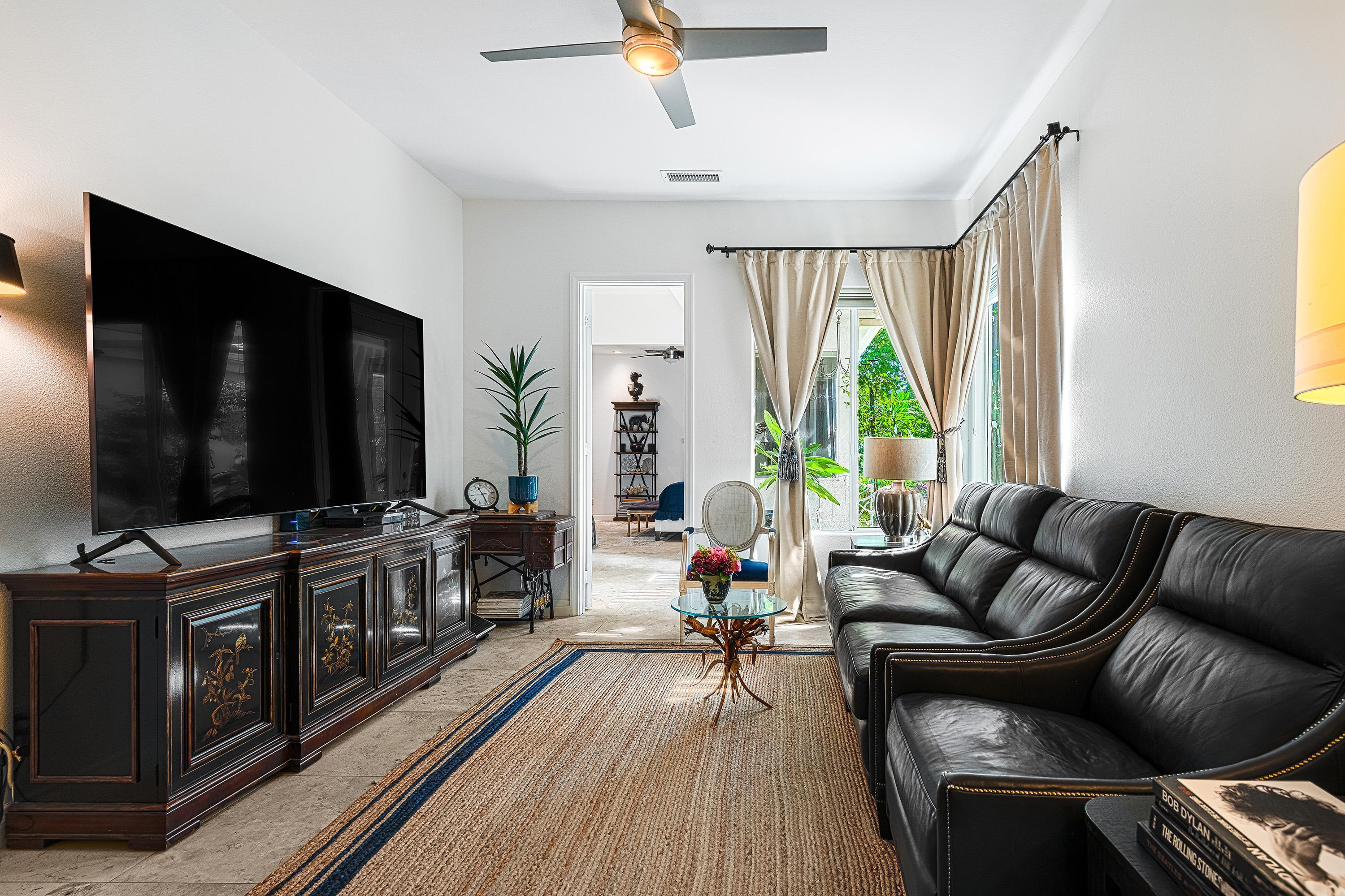 3 Trafalgar Rancho Mirage, CA 92270 - Photo 9 of 42 a living room with furniture and a flat screen tv