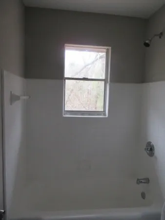 a close view of a utility room with washer and dryer