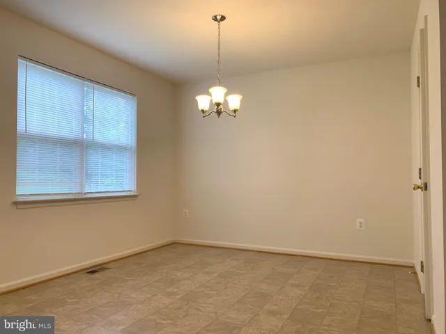 a view of a chandelier fan in a room