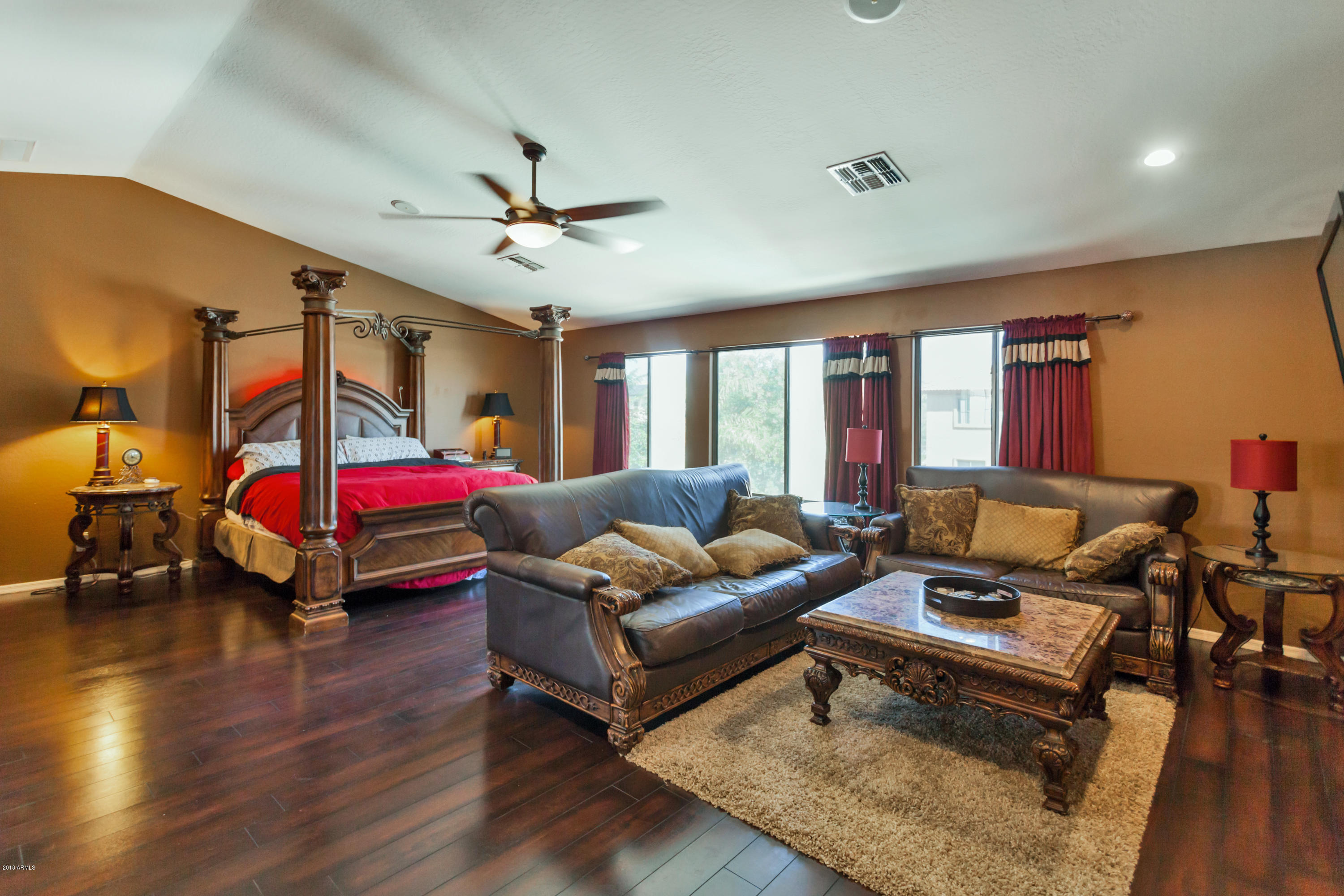 13558 West Calavar Road Surprise, AZ 85379 - Photo 11 of 31 a living room with furniture and a chandelier