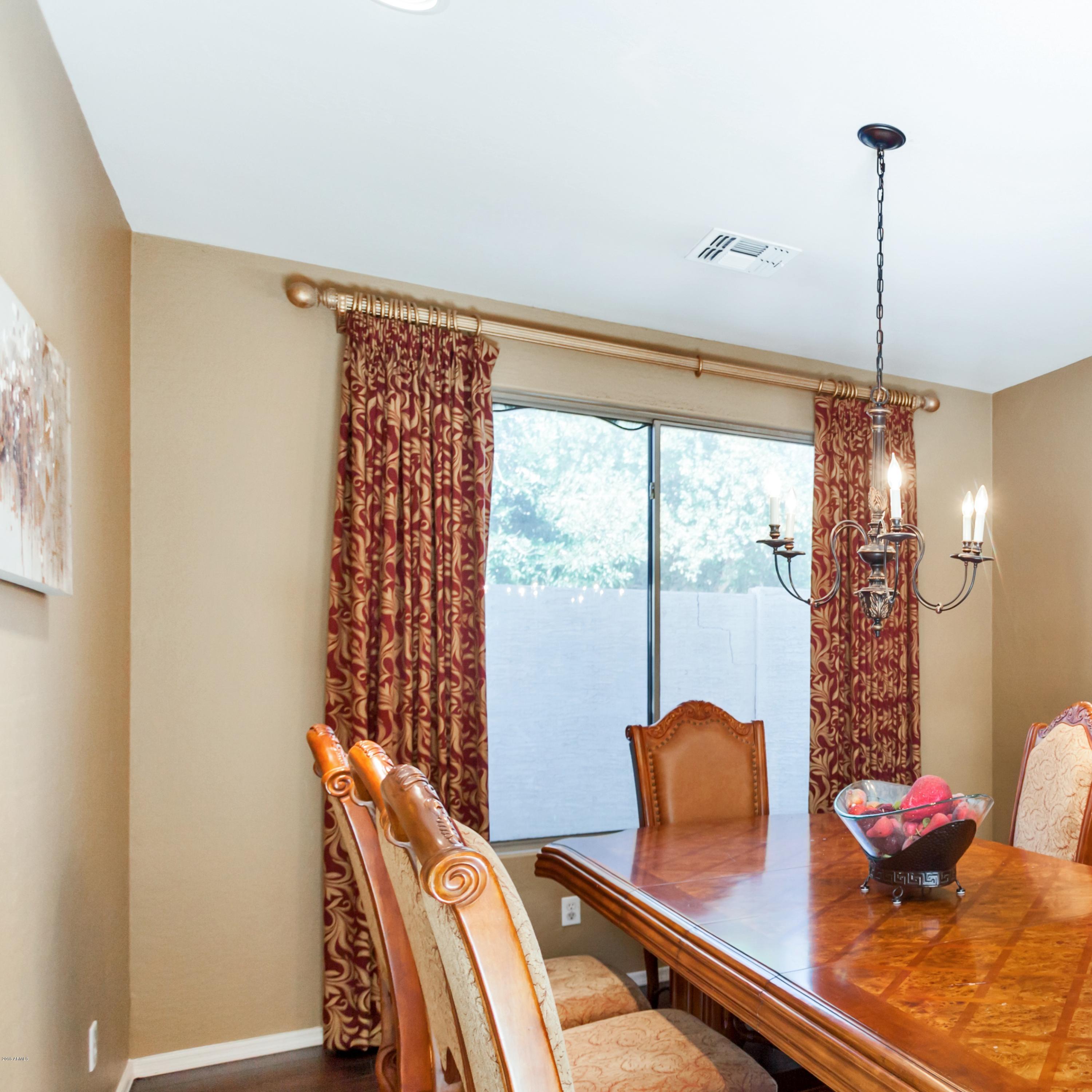 13558 West Calavar Road Surprise, AZ 85379 - Photo 18 of 31 a view of a workspace with furniture and a window