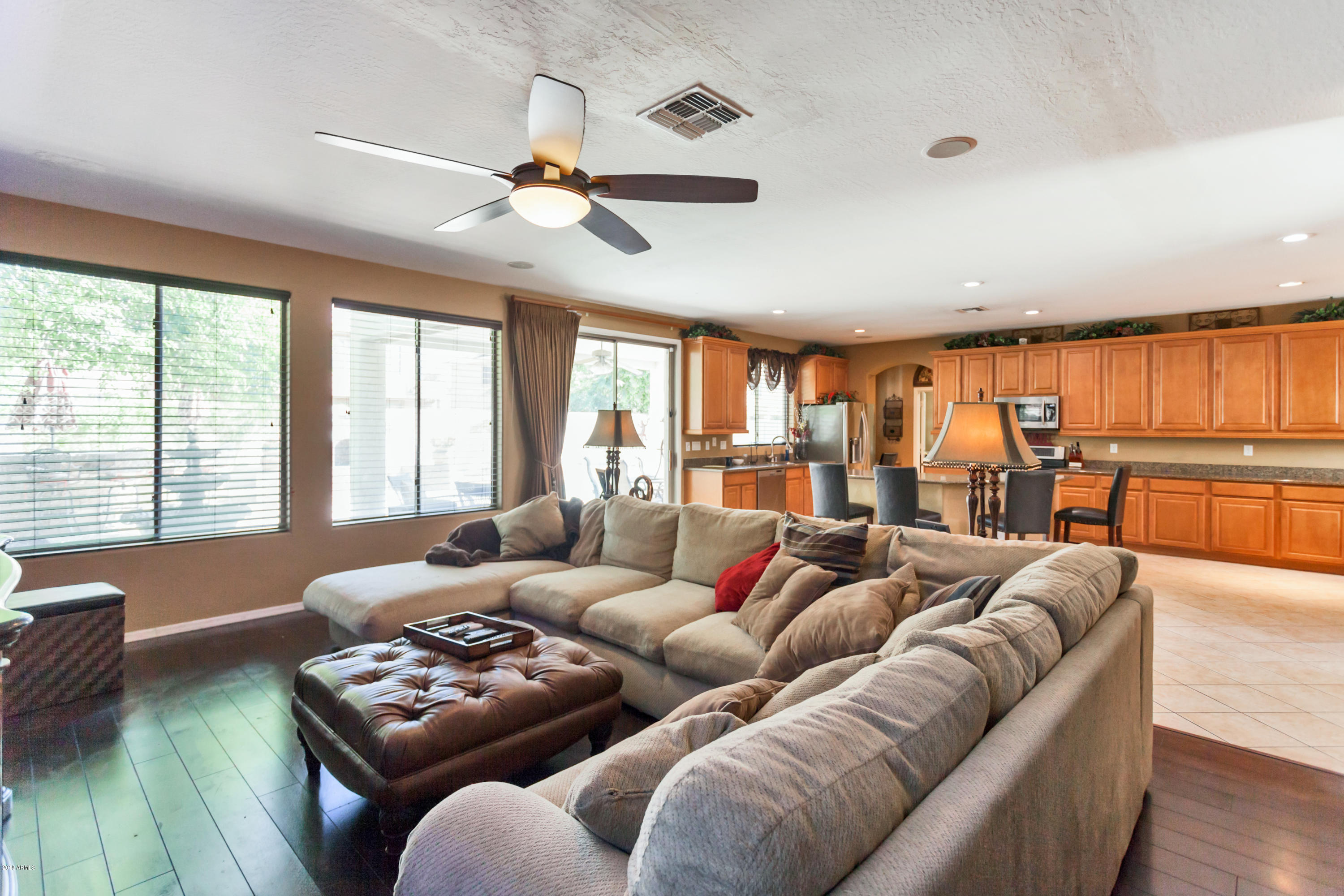 13558 West Calavar Road Surprise, AZ 85379 - Photo 3 of 31 a living room with furniture and a large window