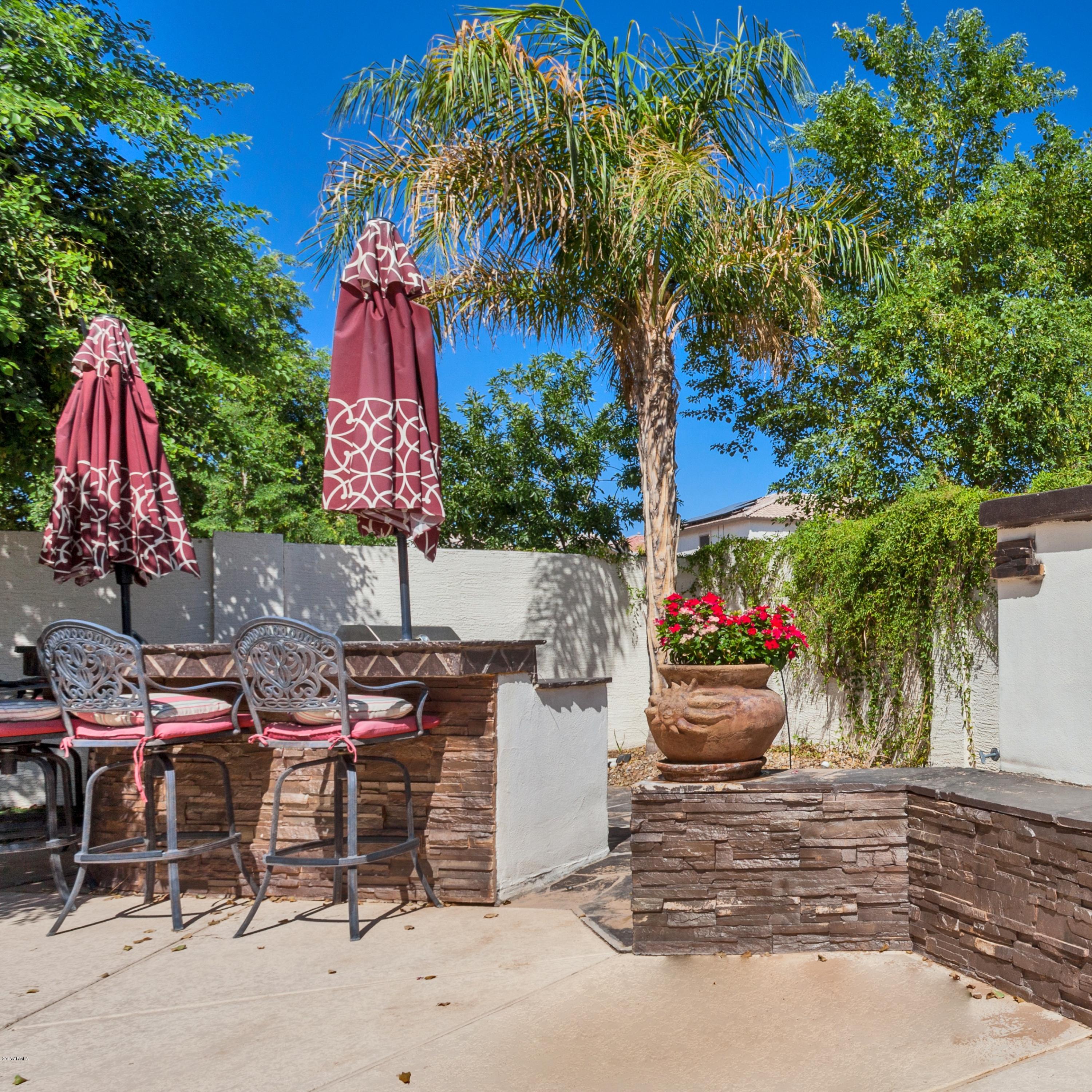 13558 West Calavar Road Surprise, AZ 85379 - Photo 31 of 31 a view of a chairs and table in patio