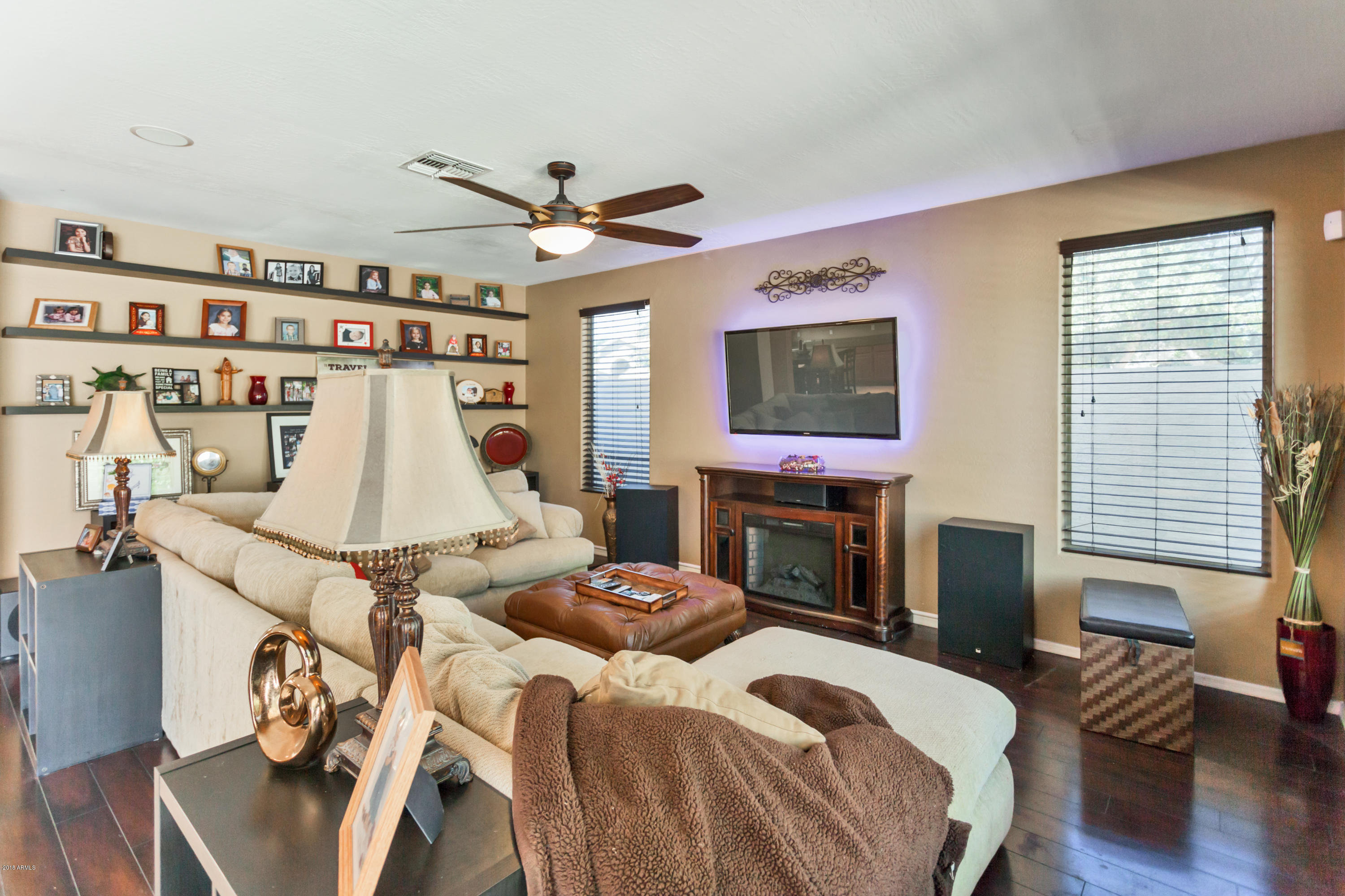 13558 West Calavar Road Surprise, AZ 85379 - Photo 4 of 31 a bed room with a bed and a fireplace