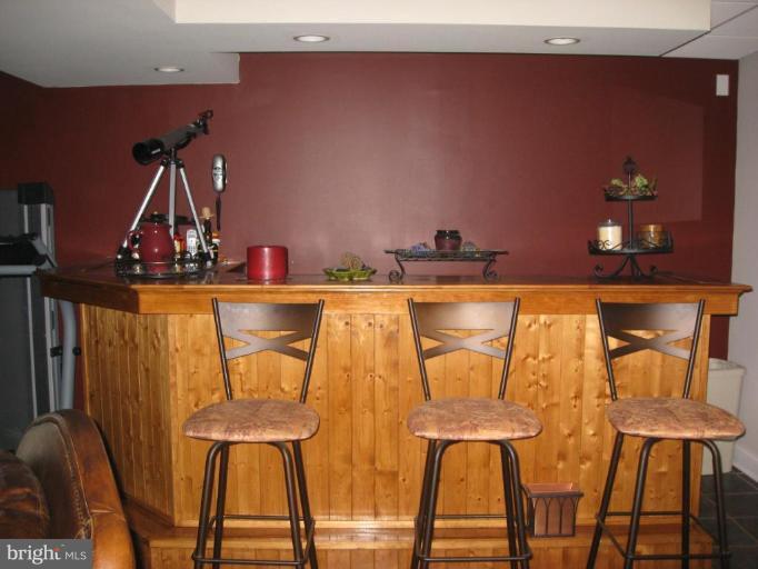 5345 Huntingtown Road Huntingtown, MD 20639 - Photo 12 of 12 a view of a dining room with furniture and wooden floor