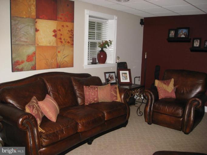 5345 Huntingtown Road Huntingtown, MD 20639 - Photo 10 of 12 a living room with furniture and a window