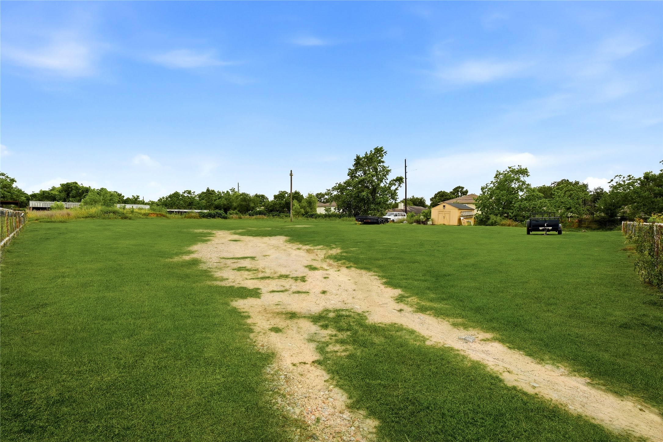 11741 Ezekiel Road Tomball, TX 77375 - Photo 23 of 30 a view of a golf course with a lake