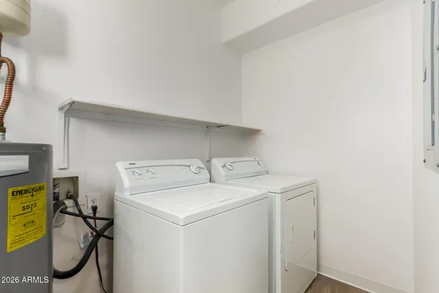 a utility room with dryer and washer