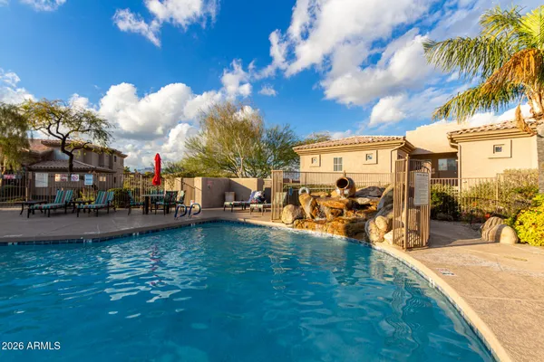 a view of a swimming pool and lounge chair