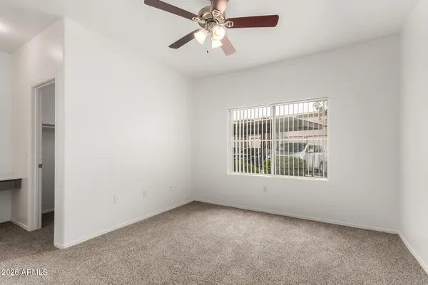 a view of an empty room with a window