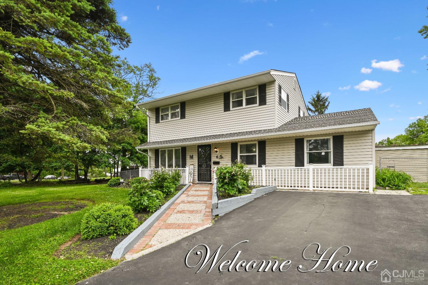 6 Calvin Road Kendall Park, NJ 08824 - Photo 1 of 30 a front view of a house with garden