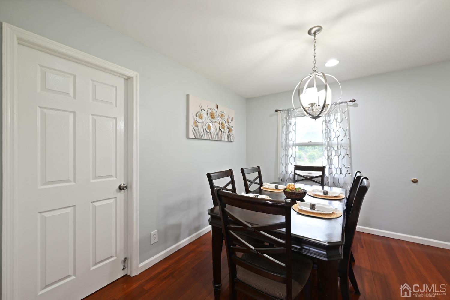 6 Calvin Road Kendall Park, NJ 08824 - Photo 14 of 30 a view of a dining room with furniture wooden floor and chandelier