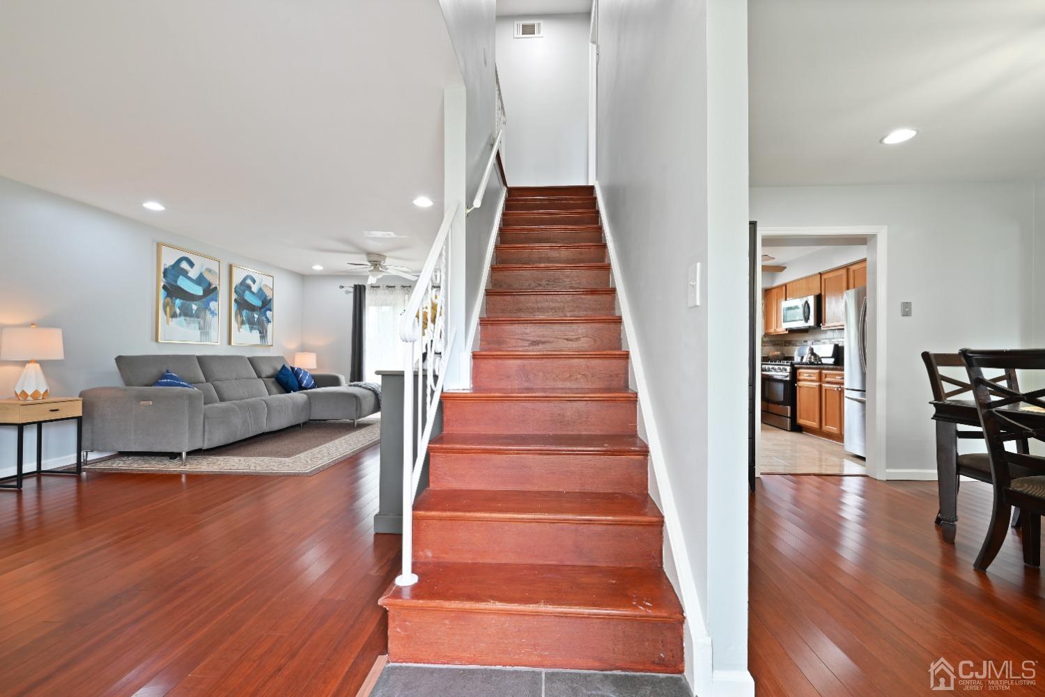 6 Calvin Road Kendall Park, NJ 08824 - Photo 16 of 30 a view of a livingroom with furniture wooden floor and windows