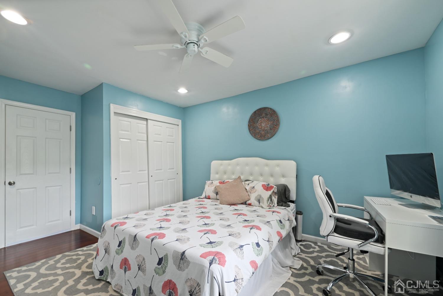 6 Calvin Road Kendall Park, NJ 08824 - Photo 18 of 30 a bedroom with a bed and a lamp