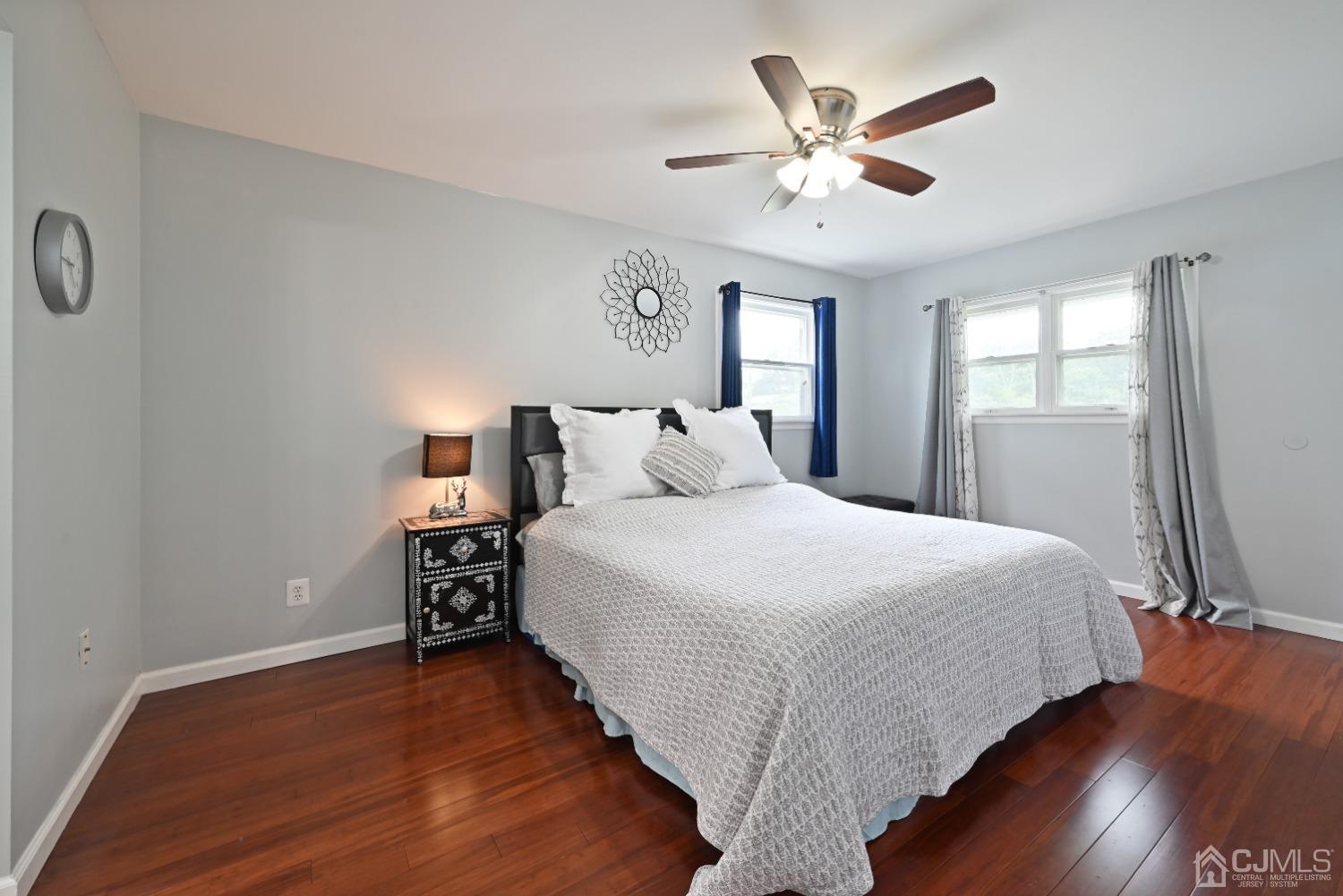 6 Calvin Road Kendall Park, NJ 08824 - Photo 19 of 30 a bedroom with a bed and a ceiling fan