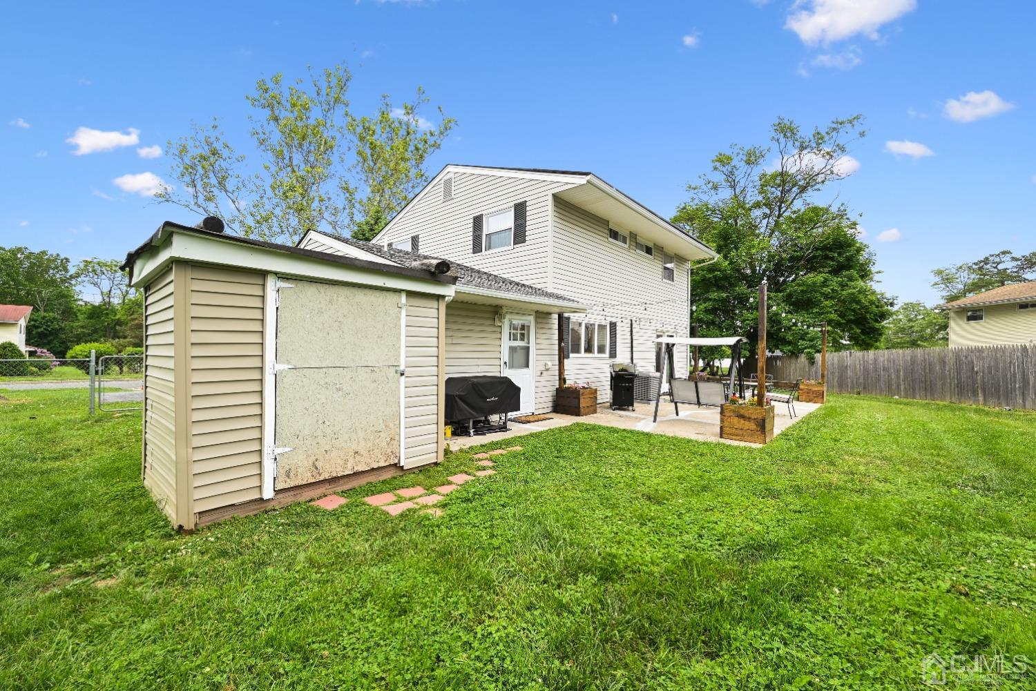 6 Calvin Road Kendall Park, NJ 08824 - Photo 27 of 30 a view of a house with backyard