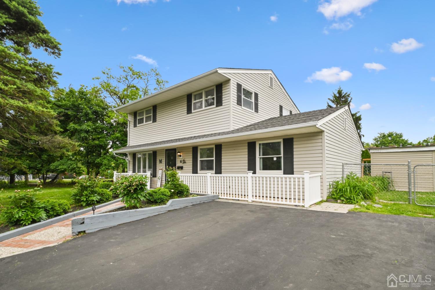 6 Calvin Road Kendall Park, NJ 08824 - Photo 3 of 30 a view of a house with a yard