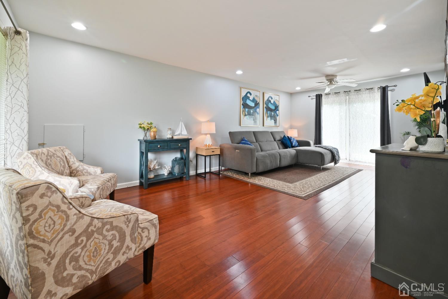 6 Calvin Road Kendall Park, NJ 08824 - Photo 5 of 30 a living room with furniture and a wooden floor