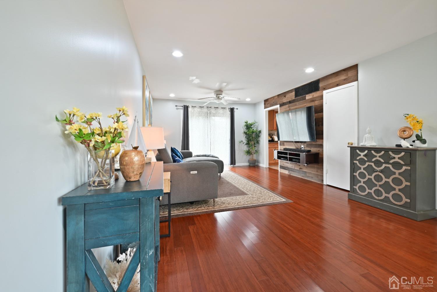 6 Calvin Road Kendall Park, NJ 08824 - Photo 6 of 30 a living room with furniture and wooden floor