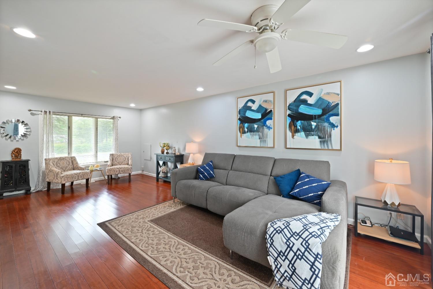 6 Calvin Road Kendall Park, NJ 08824 - Photo 7 of 30 a living room with furniture a couch and wooden floor