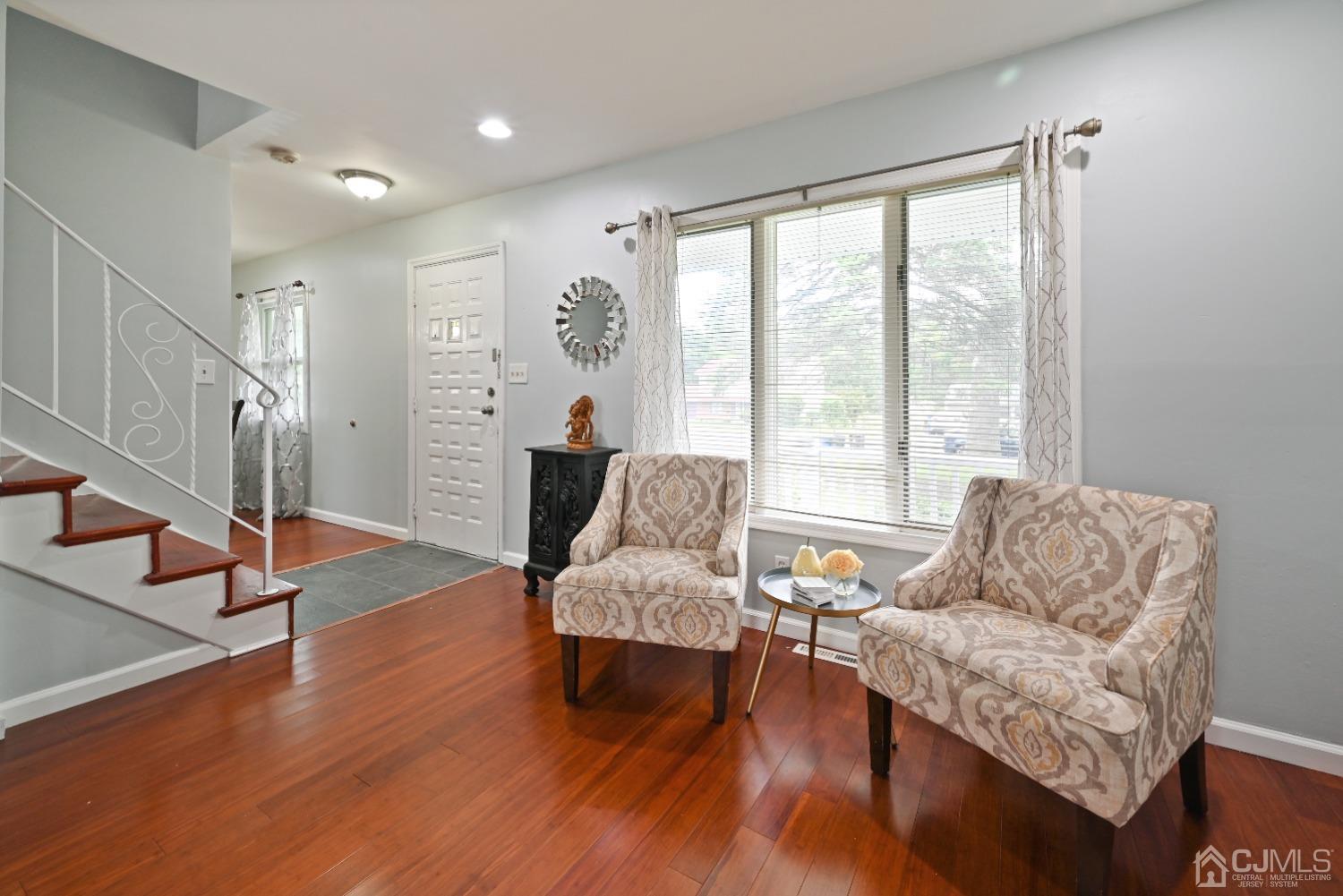 6 Calvin Road Kendall Park, NJ 08824 - Photo 8 of 30 a living room with furniture and a large window