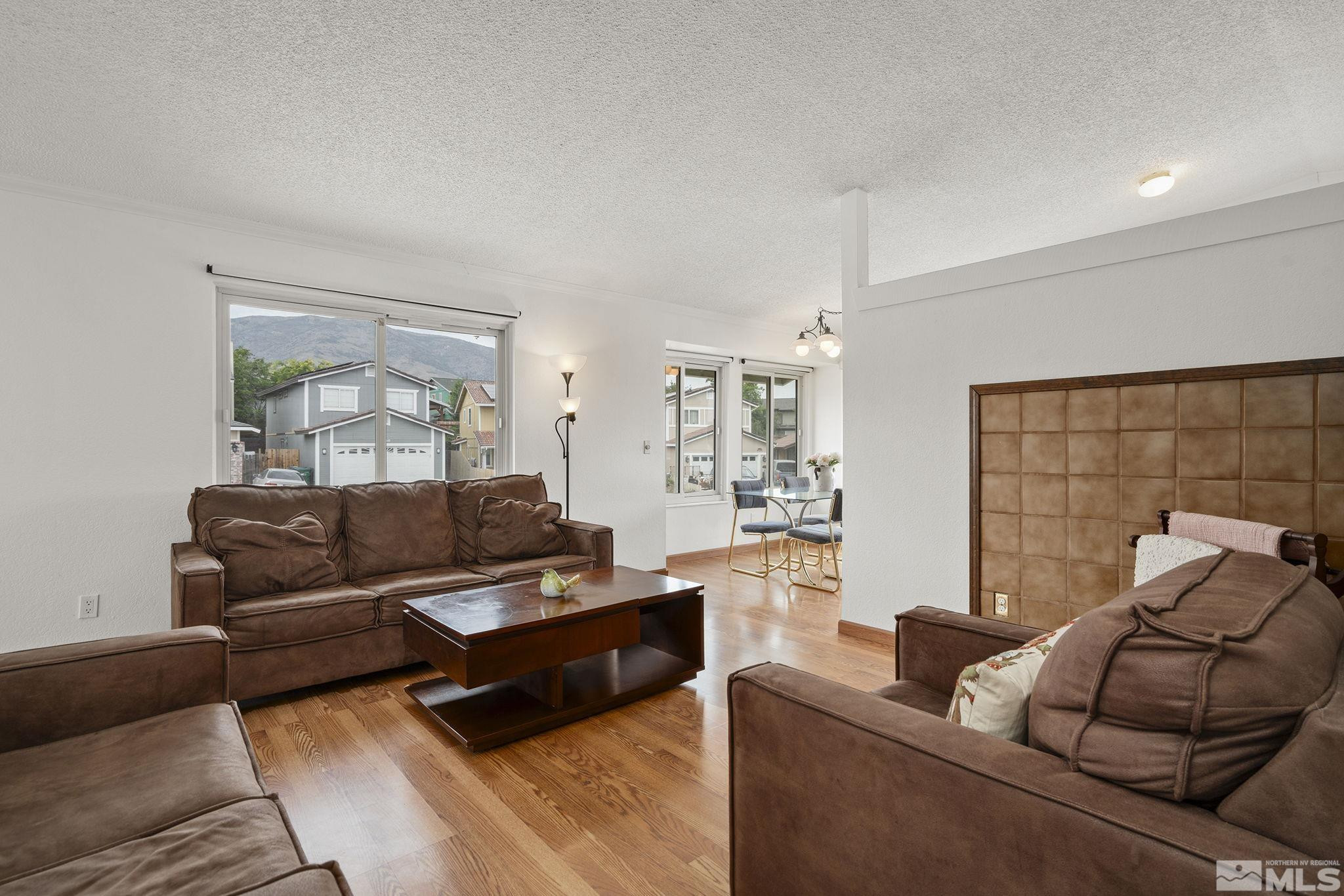 6885 Flower Street Reno, NV 89506 - Photo 5 of 21 a living room with furniture and a couch