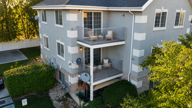 30 West 7500th Street South, Unit 18 Midvale, UT 84047 - Photo 2 of 14 Multi-story building featuring stucco exterior with stone accents and white window trim