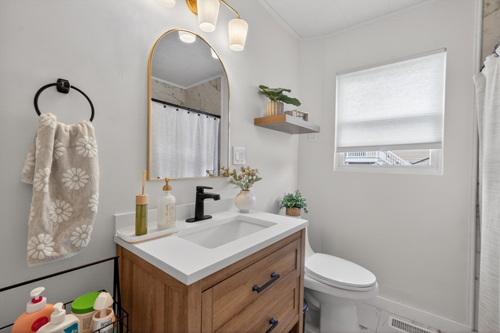 37 Blakely Court Fall River, MA 02720 - Photo 16 of 19 a bathroom with a sink toilet and vanity