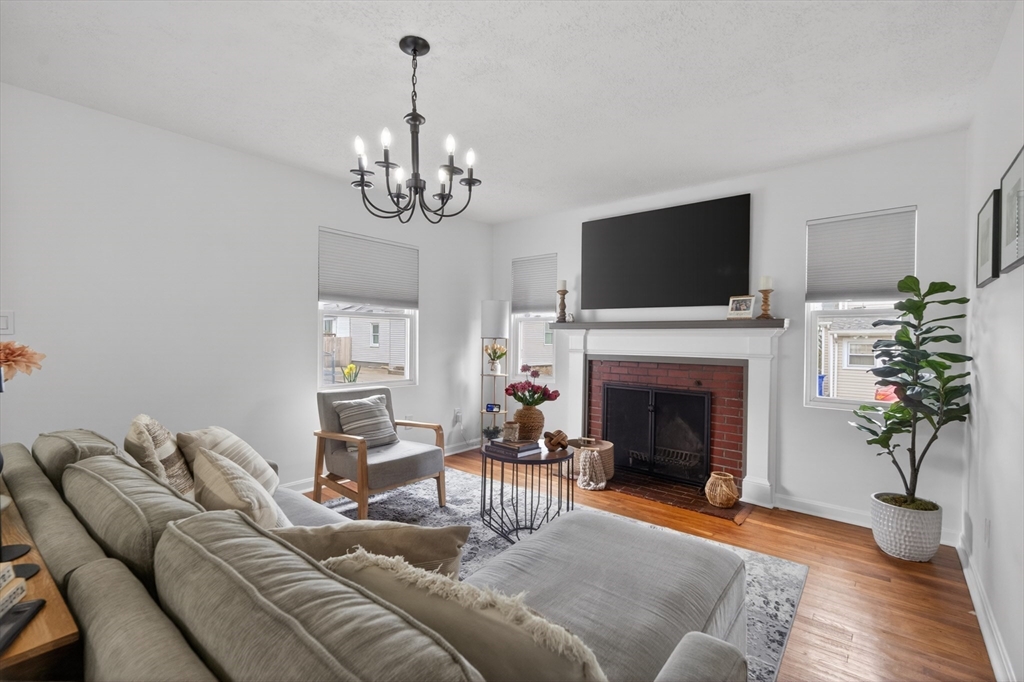 37 Blakely Court Fall River, MA 02720 - Photo 9 of 19 a living room with furniture a fireplace and a flat screen tv