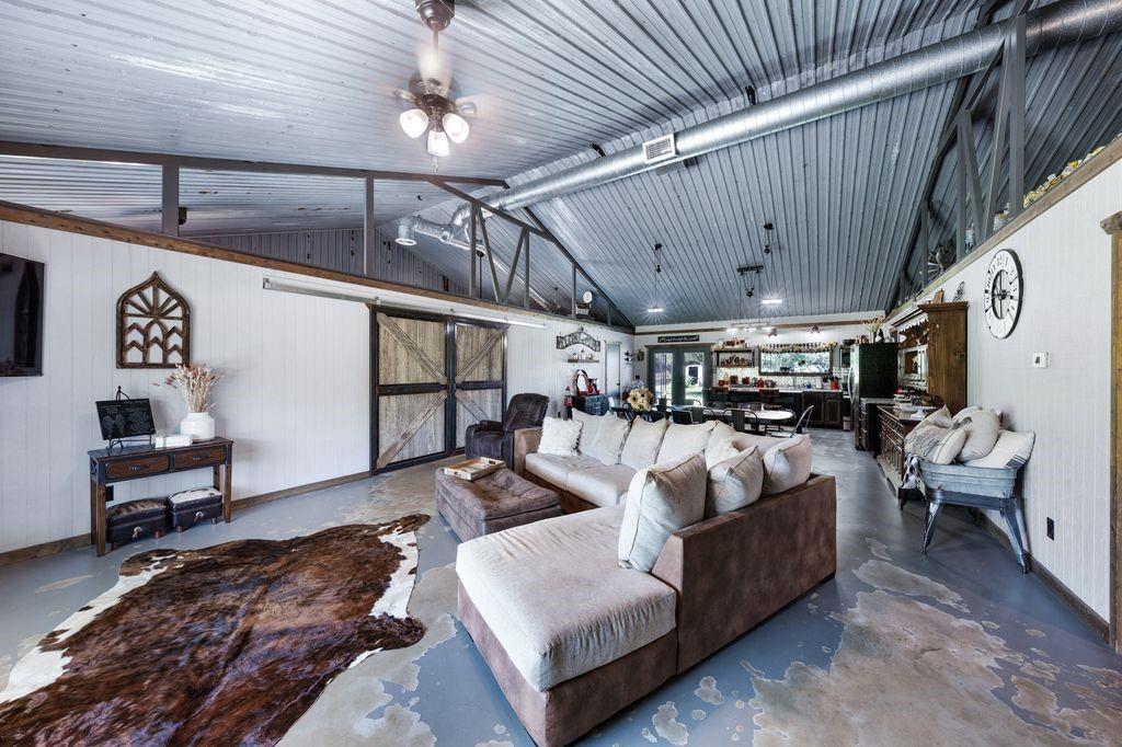 50 County Road Blossom, TX 75416 - Photo 15 of 40 a living room with furniture and a chandelier