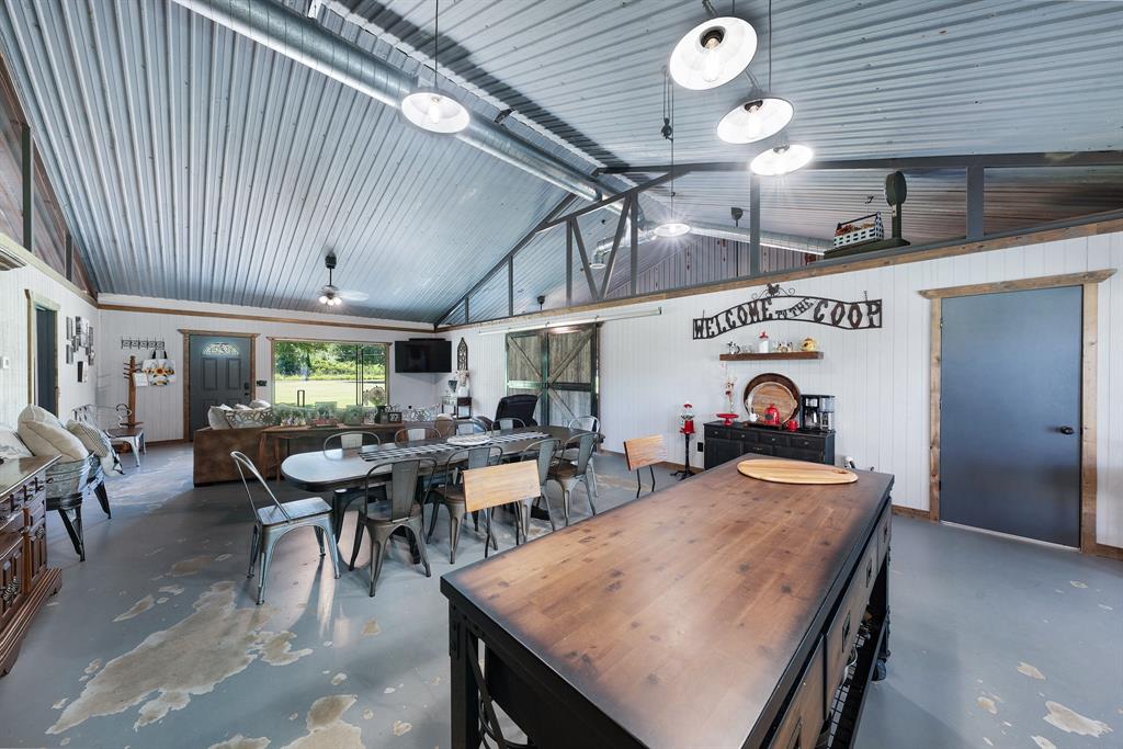 50 County Road Blossom, TX 75416 - Photo 17 of 40 a outdoor dining area with furniture and a fireplace
