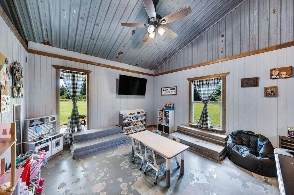 50 County Road Blossom, TX 75416 - Photo 24 of 40 a living room with furniture a window and a flat screen tv