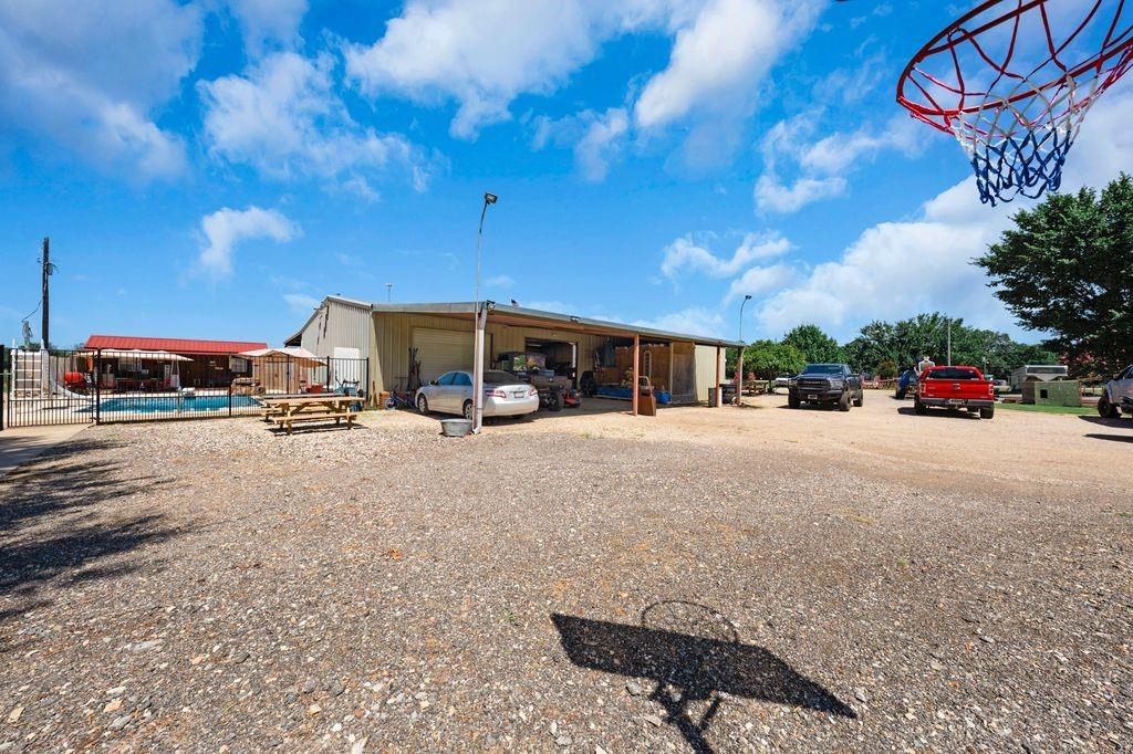50 County Road Blossom, TX 75416 - Photo 33 of 40 a view of street with parked cars